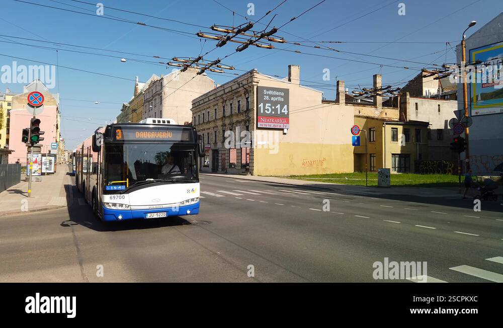 Public transport on one of the main routes through Riga Stock Video ...