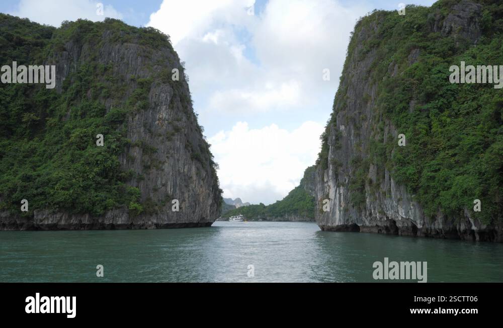 Sailing between two rock. Tourist cruise at Ha long Bay in Vietnam ...
