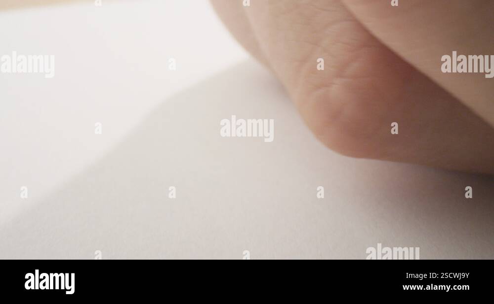 Closeup shoot of hand writing a letter on the paper with a marker ...