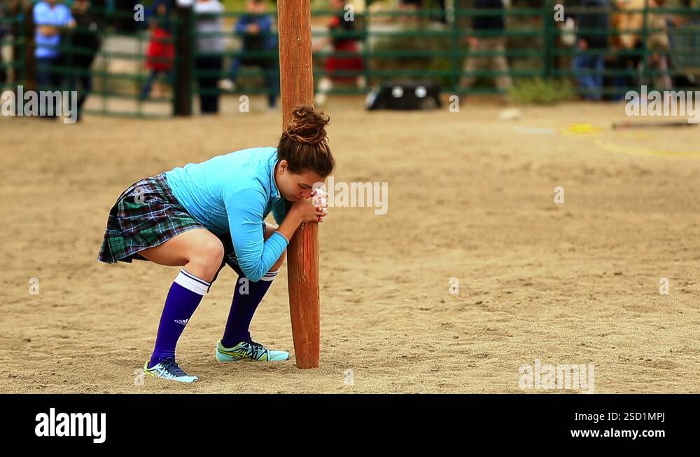 Female Scottish Highland Games Caber Toss Competitor Stock Video ...