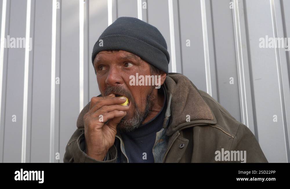 Toothless Homless Homeless man with toothless mouth trying to eat an apple Stock Video ...