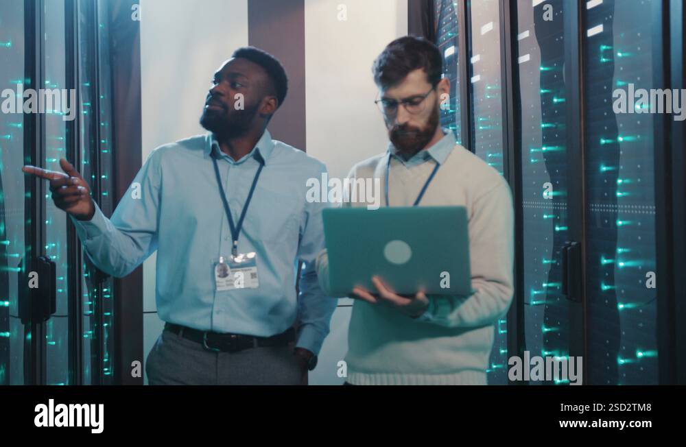Professional server engineers cooperating in high tech data center ...