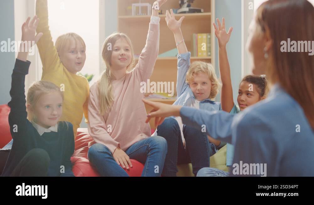 School Class: Children Sitting on Bean Bags while Teacher Explains ...
