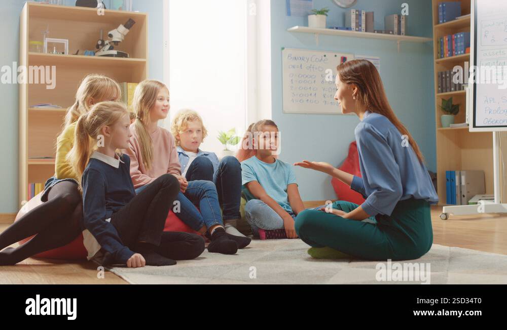 School Class: Children Sitting on Bean Bags while Teacher Explains ...