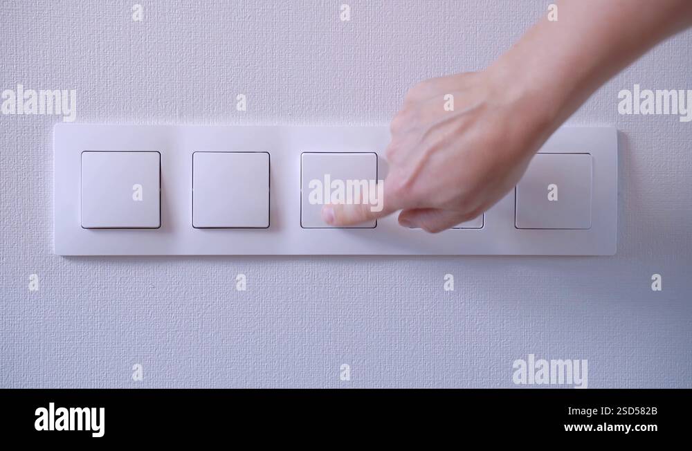 man switching on and off the light switch on the wall Stock Video ...