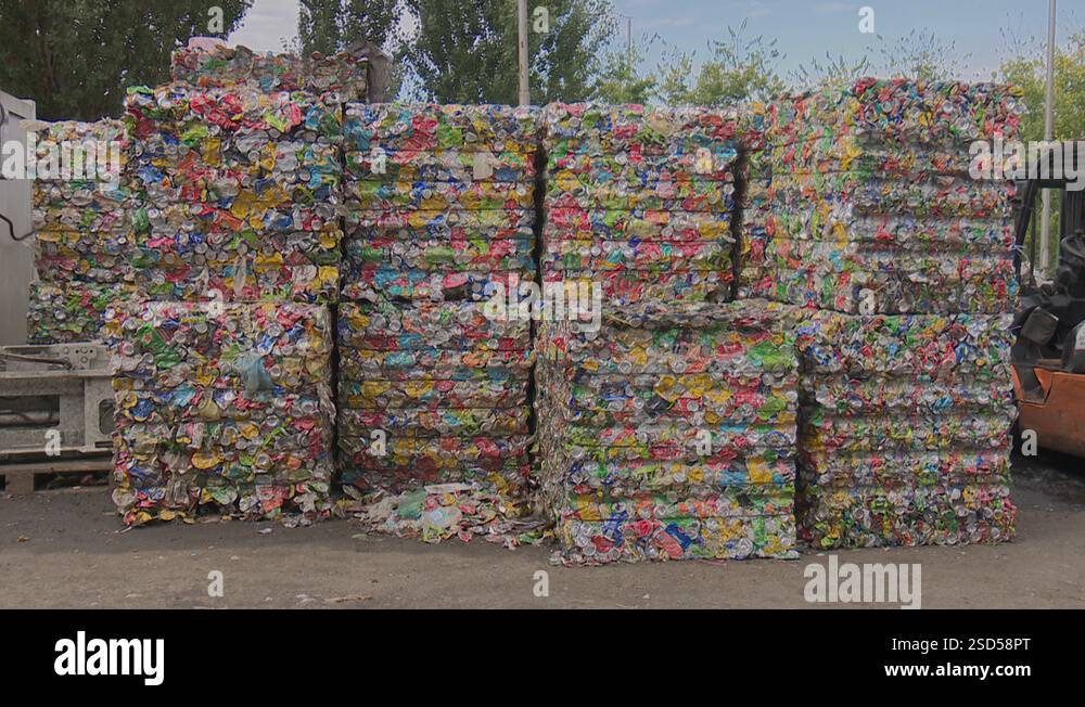 Compacted and compress aluminum waste in a cube ready for recycling ...