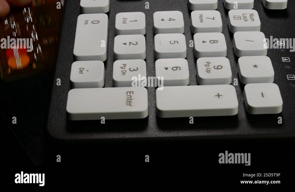 Ungraded: Plastic Card Owner Types Security Code of MasterCard on ...