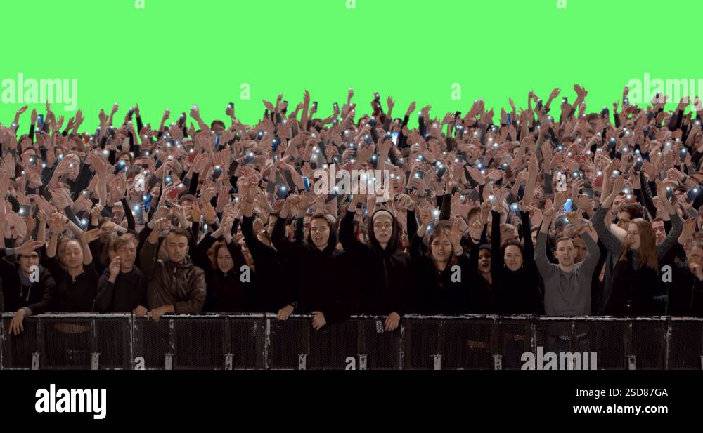 GREEN SCREEN Front view huge crowd of people with phones in hands at ...