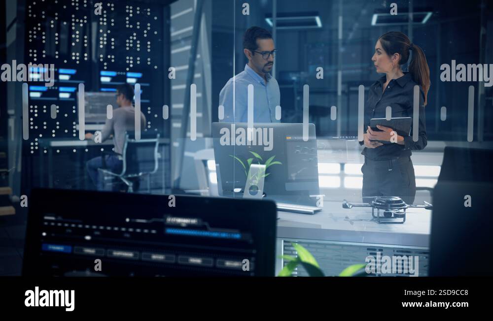 Female Project Manager and Chief Engineer Analyze Data on Tablet and ...