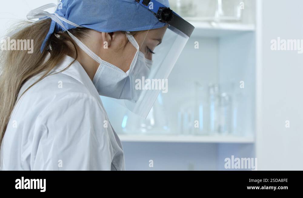 Woman lab technician adding swab test in tube and sealing Stock Video ...