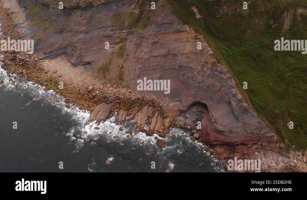 Lighthouse on a massive cliffs, aerial upward movement Stock Video ...