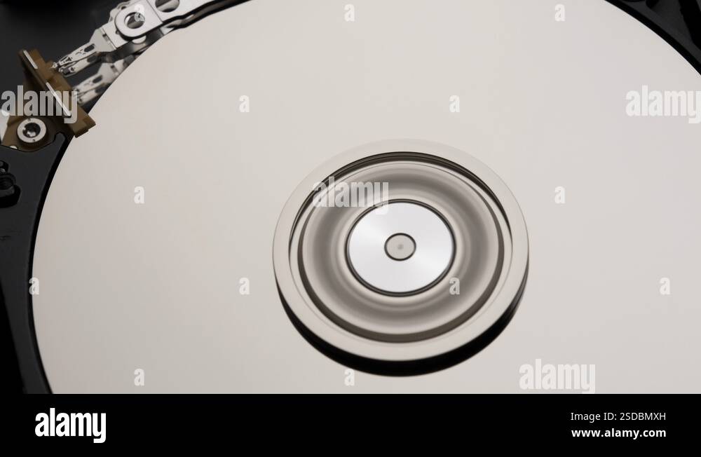 Close-Up of Computer Hard Disk Drive Spinning and Writing then Rotation ...