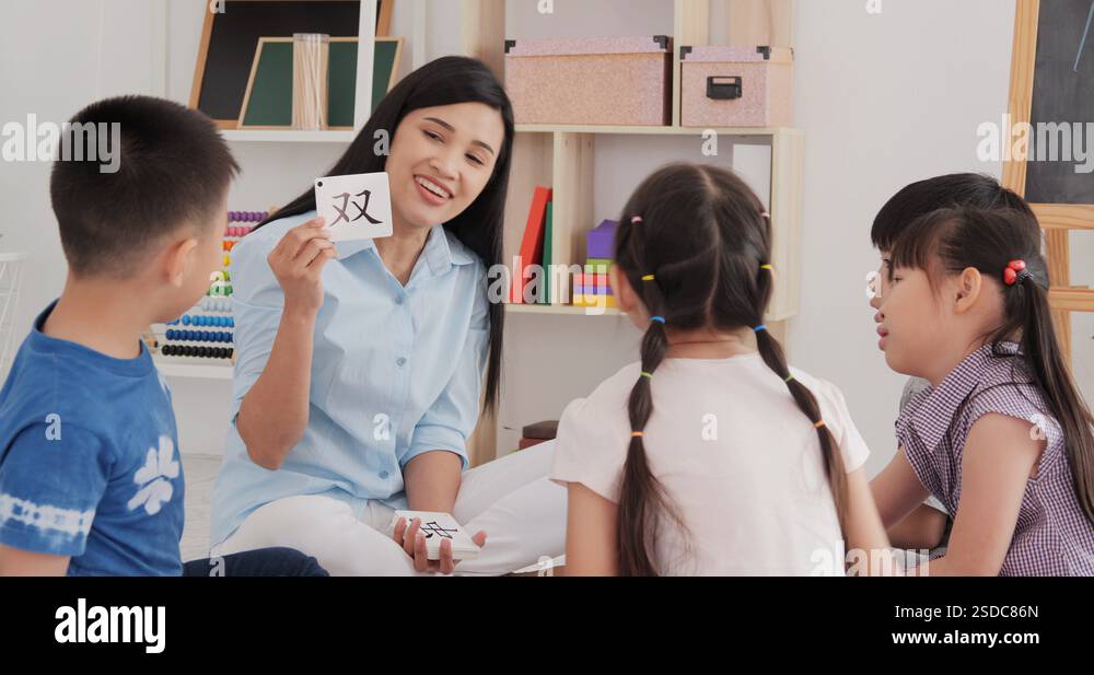 Student In Chinese Language Asian female teacher teaching student to chinese language at school ...