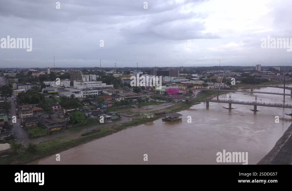 Aerial drone view of Acre river and flag in the amazon. Rio Branco city ...