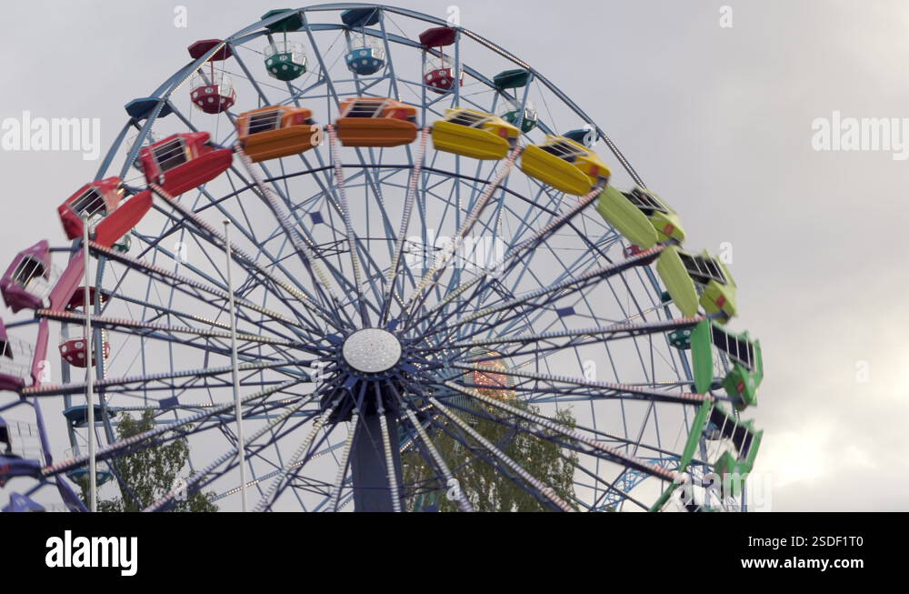 A fast moving ride going up and down inside the amusement park in ...