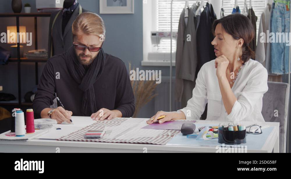 Competent male and female designers drawing sketches Stock Video ...