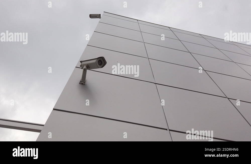 video surveillance cameras mounted on a wall of a modern building Stock ...