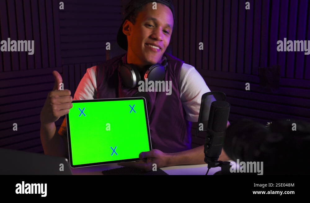 Man talking about tab device application and shows thumbs up. Green ...