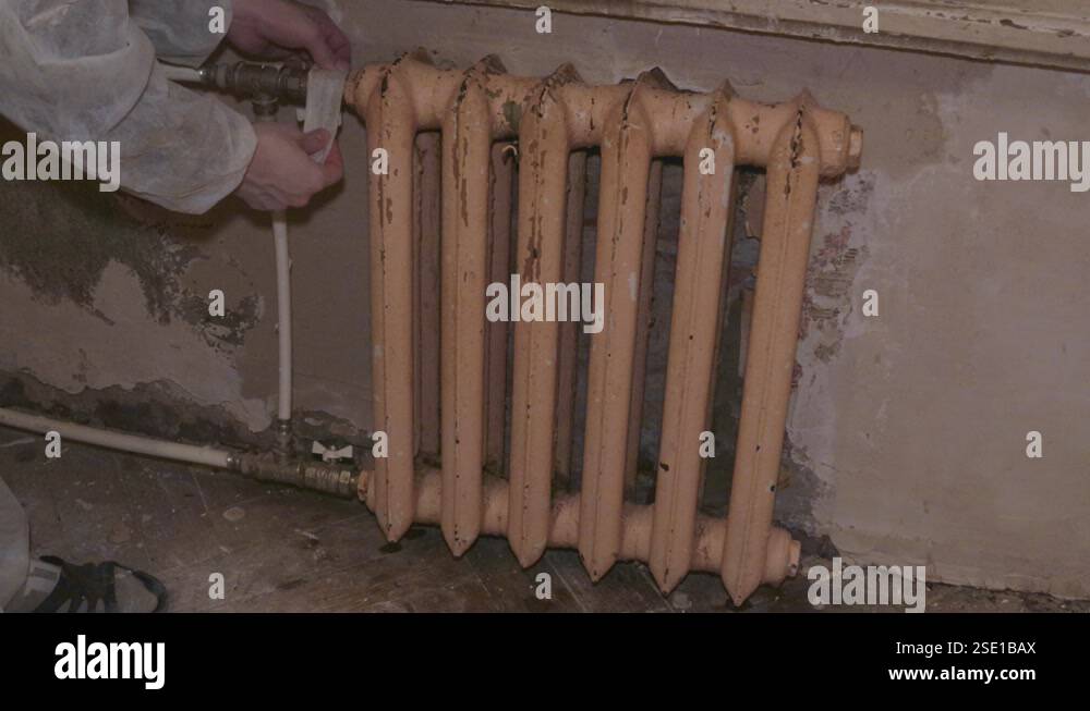 Spraying Radiators restoration repair of the old radiator heater purge compressed air ...