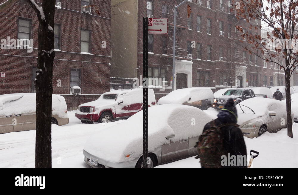 4k footage of a huge snowstorm in New York. The back of a person about ...