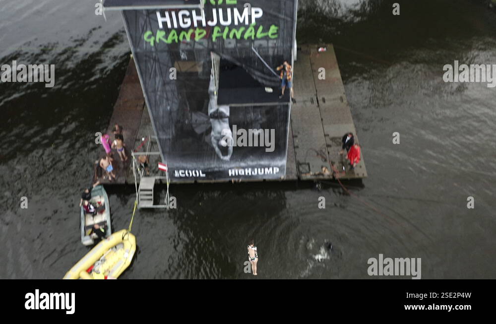 A Female Performs A Dive In A Outdoor High Jump Diving Competition ...