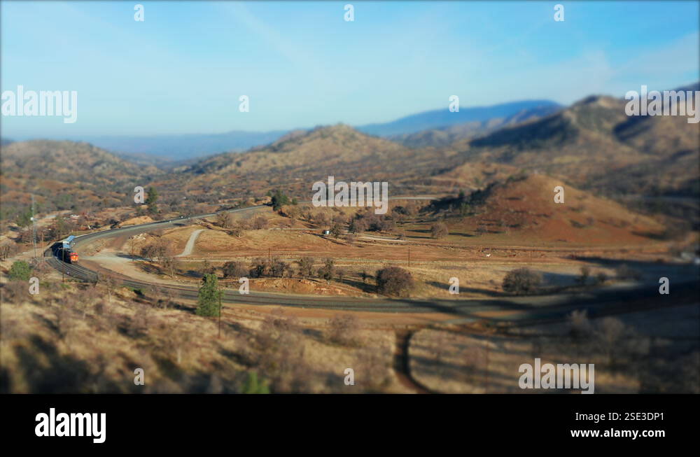 Train traveling along the Tehachapi Loop Union Pacific tracks - tilt ...