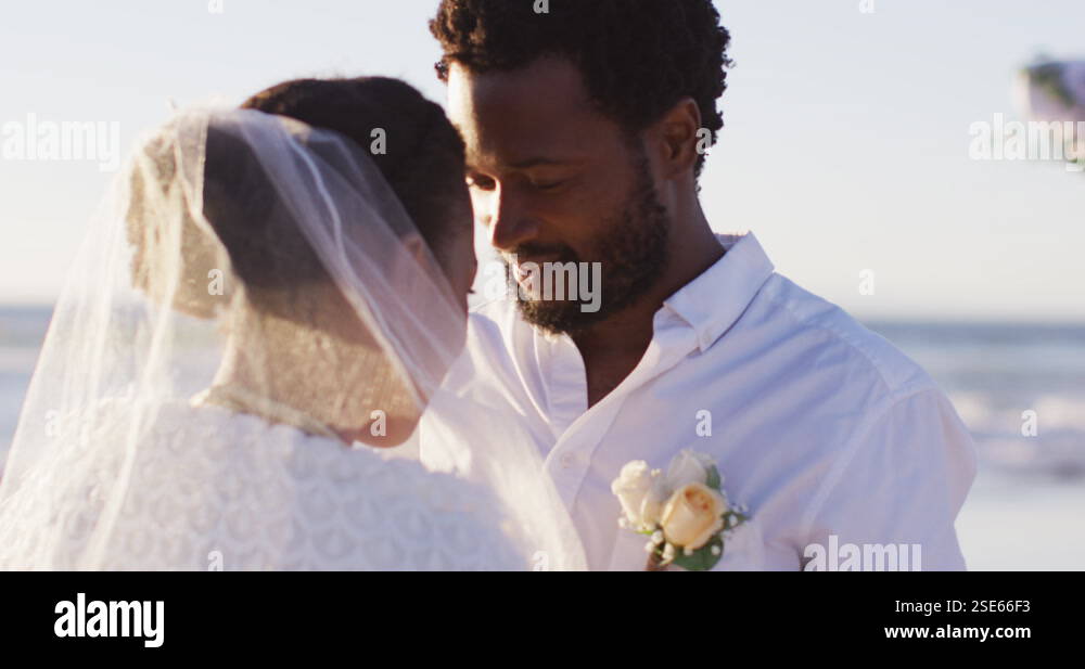 African american couple in love getting married, looking at each other ...