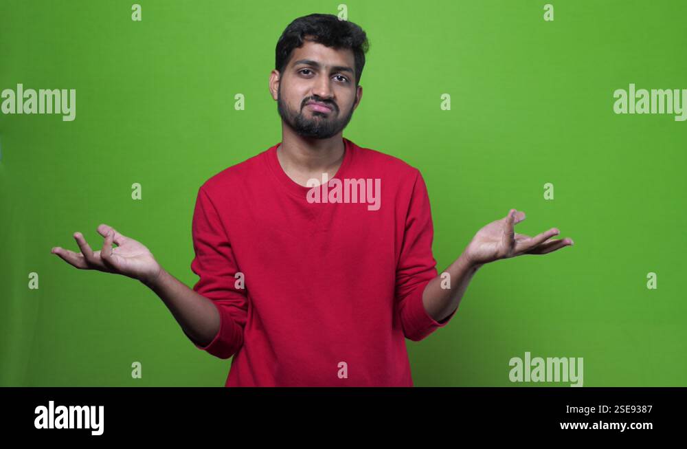 Indian man with distrust face expression. Doubtful young man looking ...