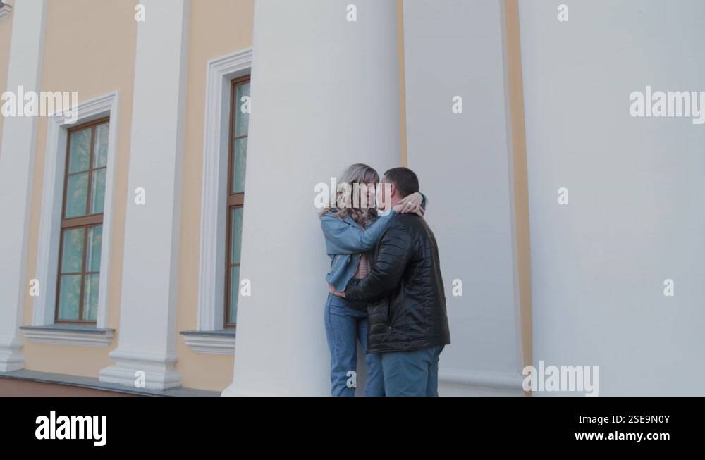 Couple in love hugs at the columns in the park Stock Video Footage - Alamy