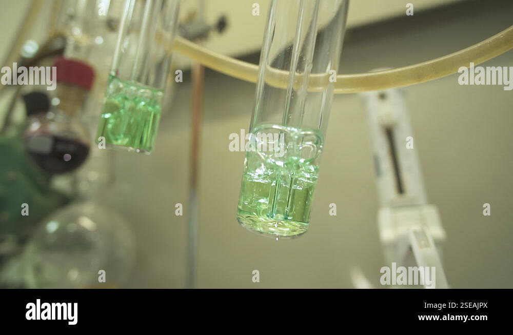 Lab Test Boiling Close-up two test tubes boiling over fire against the background of ...