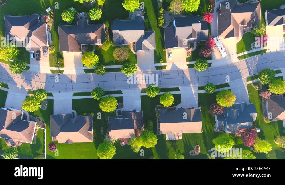 A perfect street in a perfect neighborhood in Springtime, aerial view ...