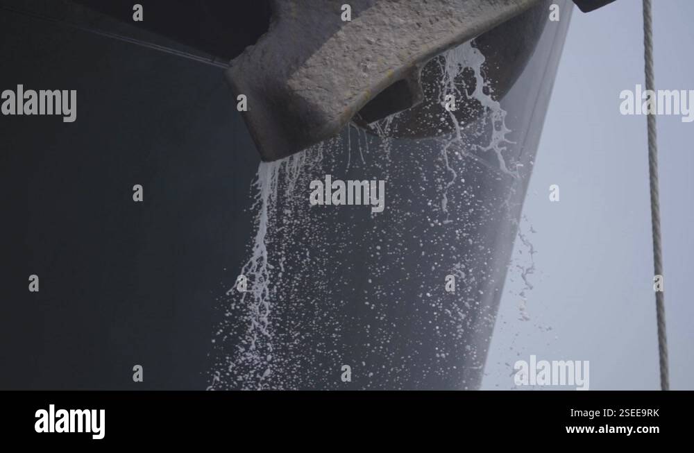 Bulk Tank Reverse Float Ballast Water Flowing Out From Bulk Carrier Ship. close up, tilt down ...