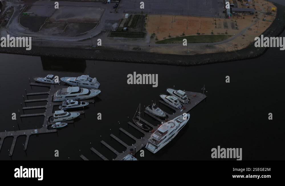 Slow aerial flyover and tilt up to reveal Fells Point in Baltimore ...