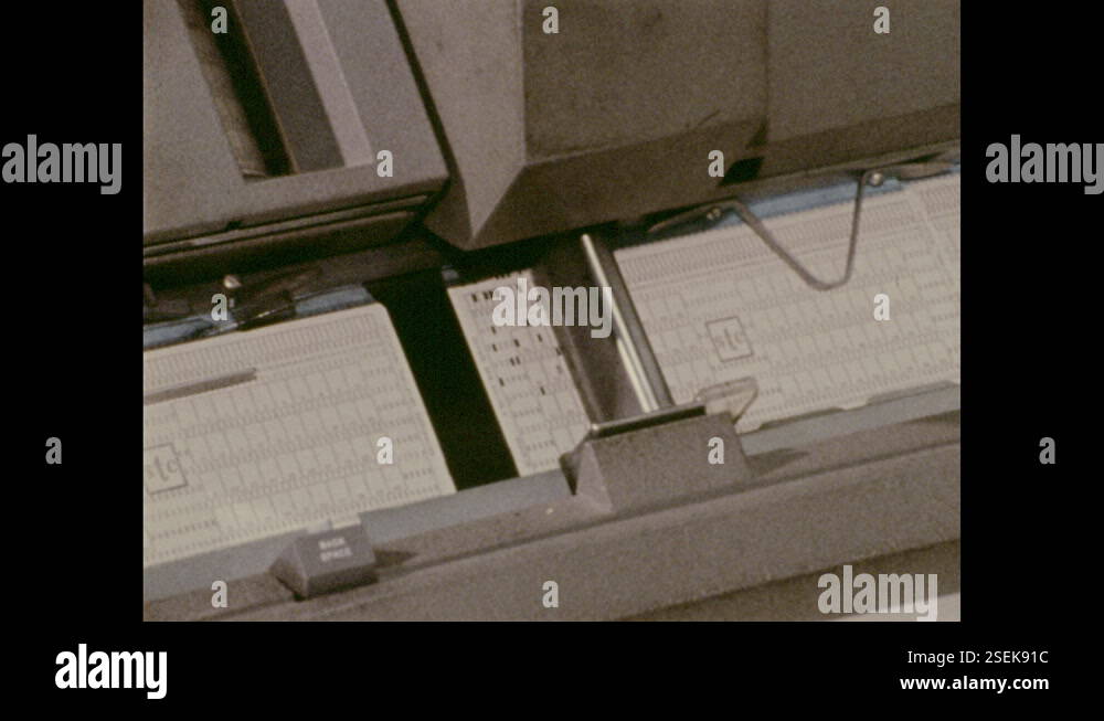1970s: Forms in document processor. Woman types on processor Stock ...