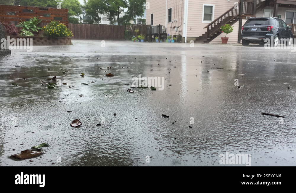Reflections Through Wet Asphalt Ground On A Rainy Day In The Backyard ...