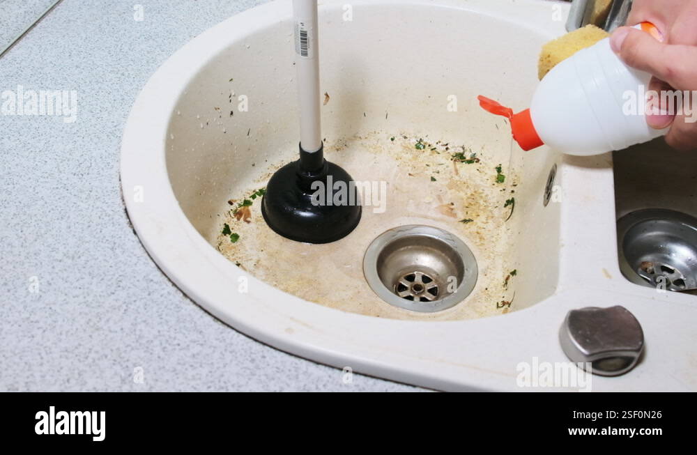 Clean Up a Clogged Sink with a Chemical Fluid at Home Kitchen, Slow ...