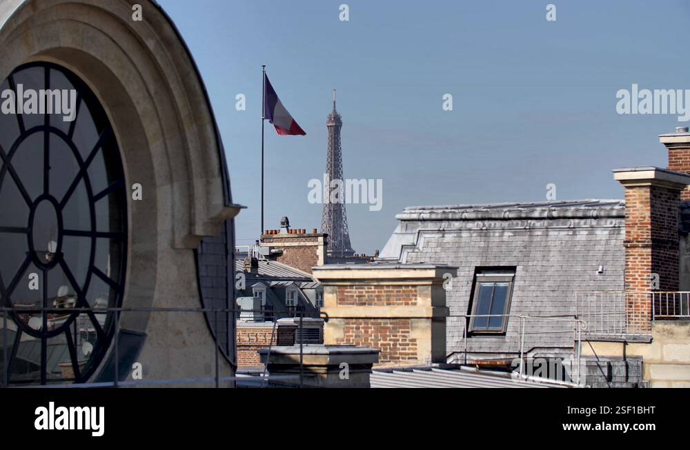 Parisian round window rooftop With Eiffel Tower and tricolore French ...