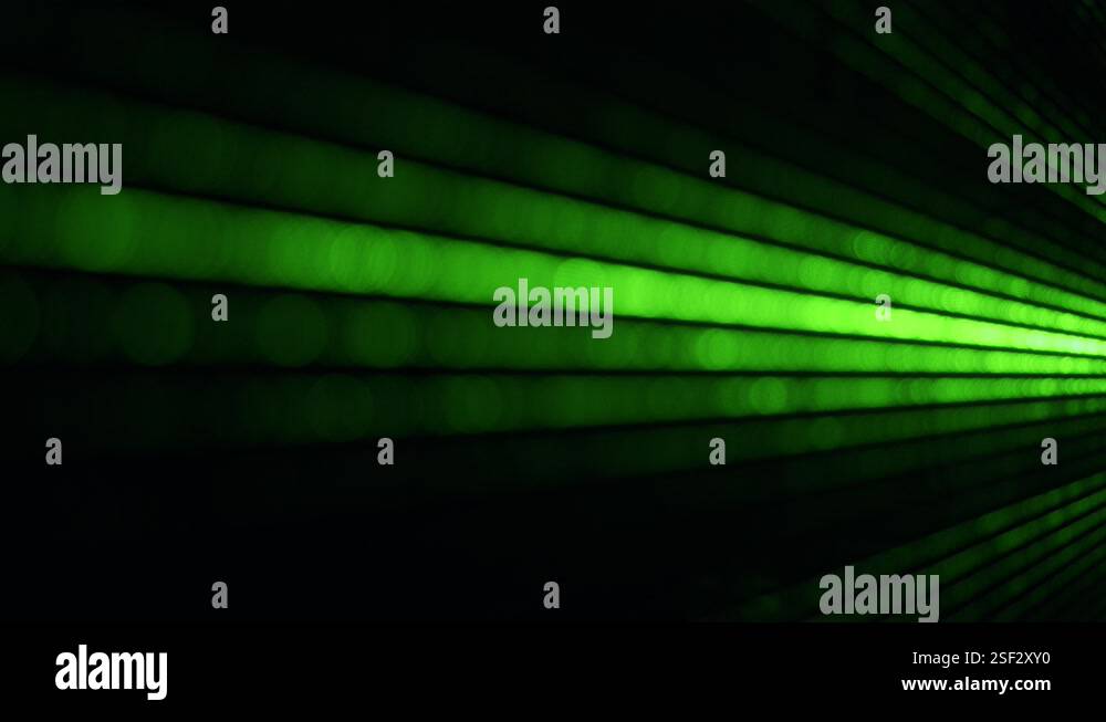 Dust particles in green laser light beam from diffraction grating Stock ...