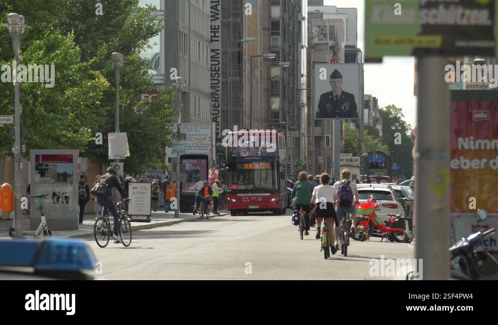 Establishing shot of the busy street of Checkpoint Charlie, Berlin ...