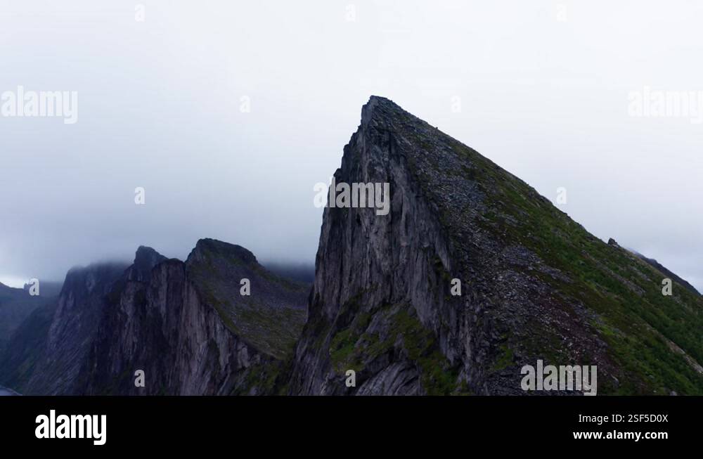 Famous Mountain Peaks Of Segla Under Overcast Sky In Senja Island ...