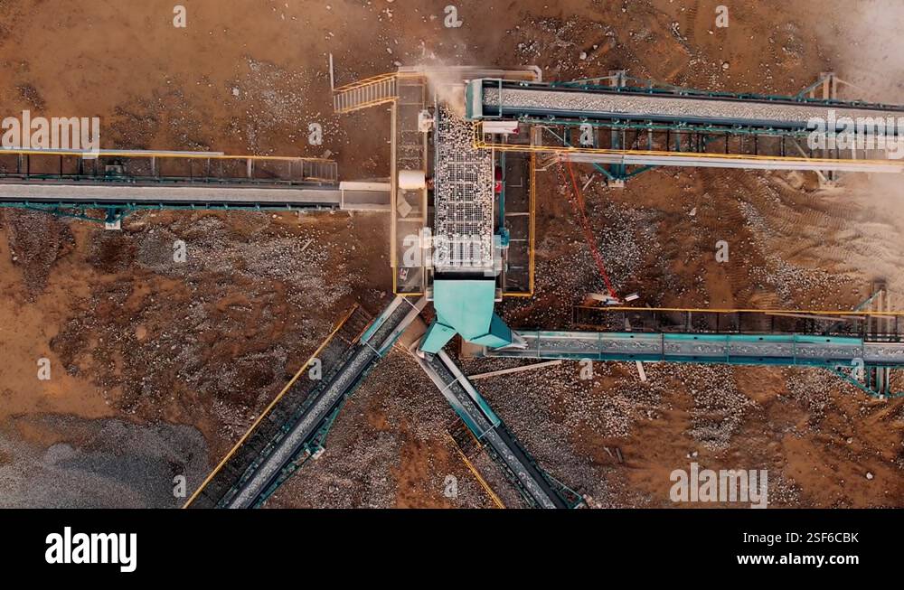 Stone crusher at open pit mining. conveyor sorts crushed stone into ...