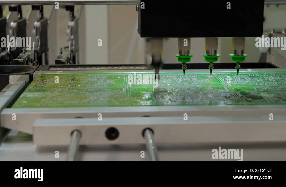 SMT pick and place machine installing SMD electronic components at ...