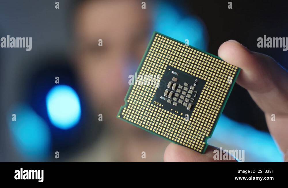 Male technician holds in hand CPU processor, Integrated circuits Stock ...