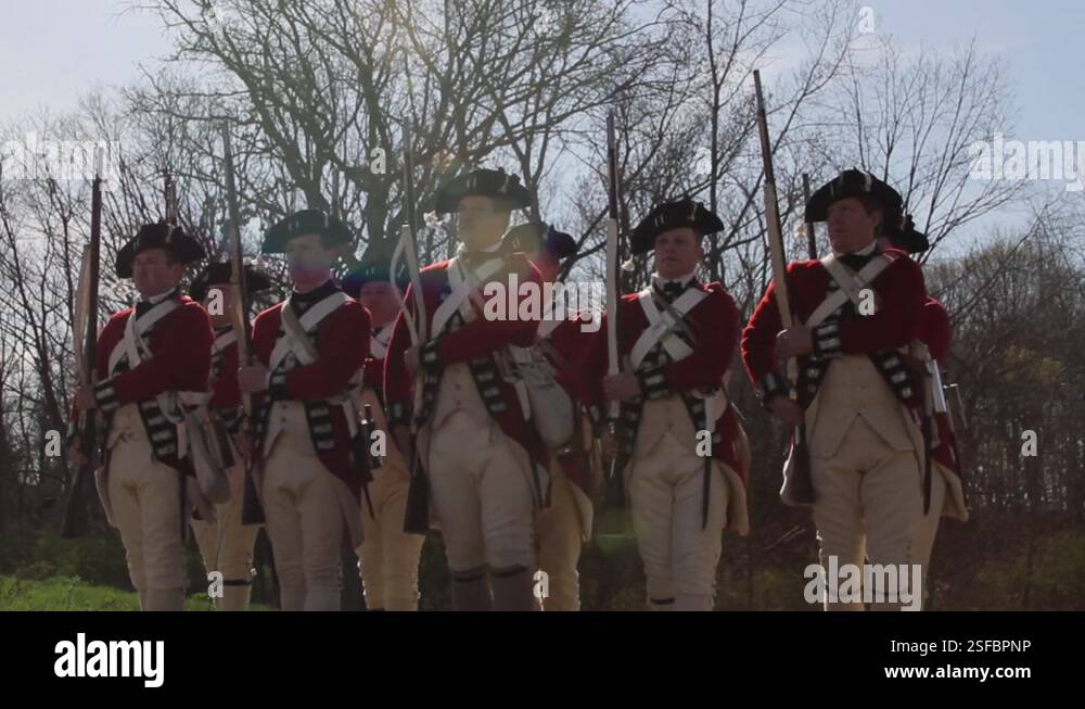 British Redcoat Re-enactor Soldiers armed with flintlock muskets, March ...
