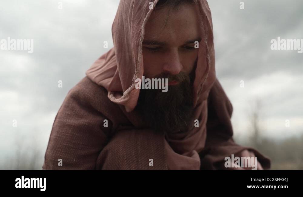 Jesus Christ or biblical prophet with a beard wearing a robe and hood ...