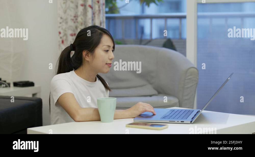 Woman use computer at home Stock Video Footage - Alamy