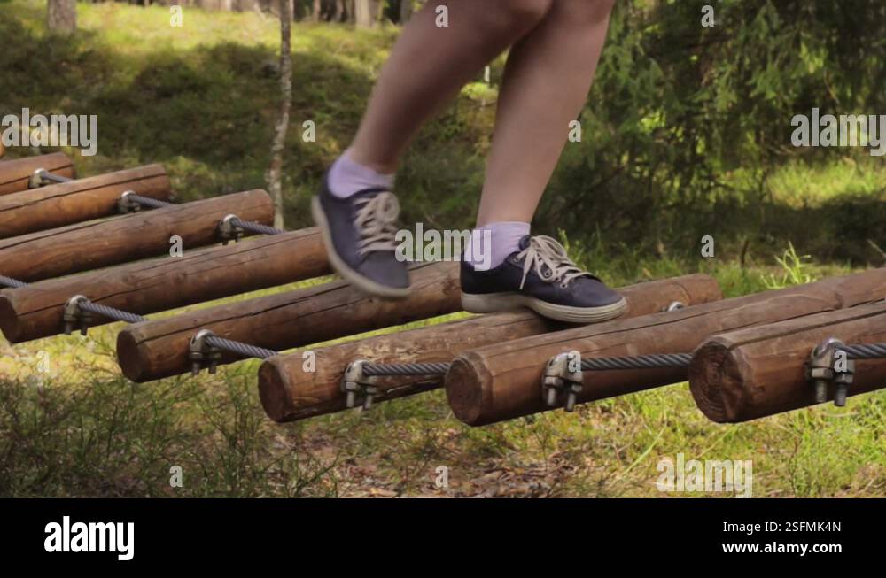 Jump Rope Logs Training to walk on rope wooden logs steadily Stock Video Footage - Alamy