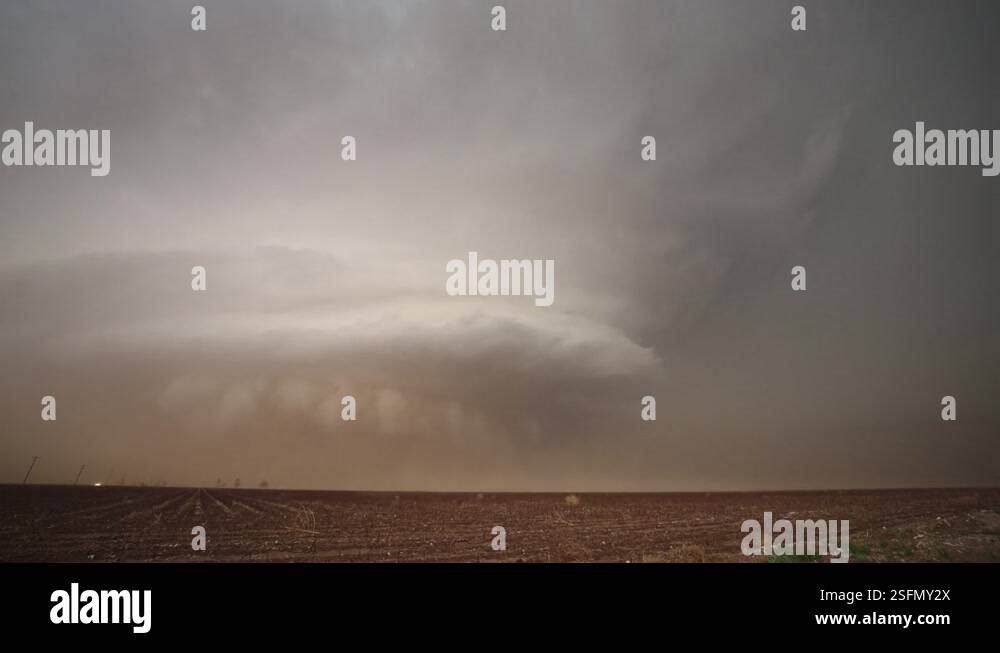 Supercell storm moving through Texas as lightning flashes and dirt ...