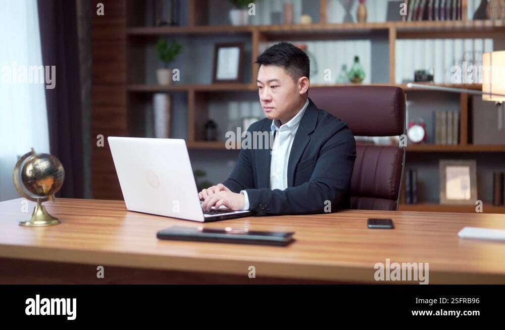 Asian business man lawyer working using laptop pc computer in modern ...