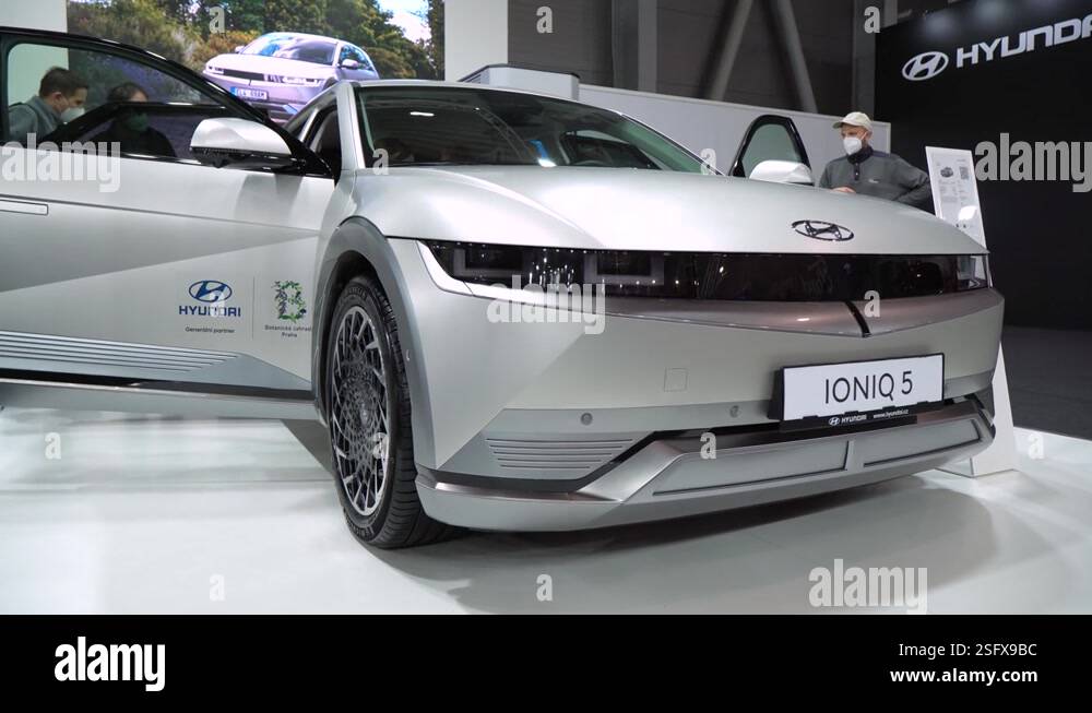 Silver Hyundai Ioniq 5 with open doors at a car exhibition - low front ...